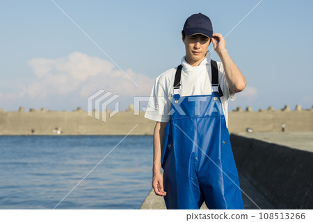 Young fishermen standing at the fishing port Young fishermen standing at the fishing port 108513266