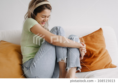 Happy asian woman in relaxed weekends day on sofa in the house 108515013