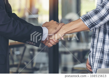 Teamwork partner two men team shaking hands together. Businessman contractor handshake with Business Partner Trust Partnership. Industrail people contractor dealing mission team meeting office desk Teamwork partner two men team shaking hands together. Businessman contractor handshake with Business Partner Trust Partnership. Industrail people contractor dealing mission team meeting office desk 108515613