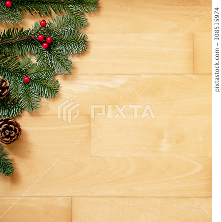 Christmas background of green fir branches with red berries and brown cones. Christmas background of green fir branches with red berries and brown cones. 108515974