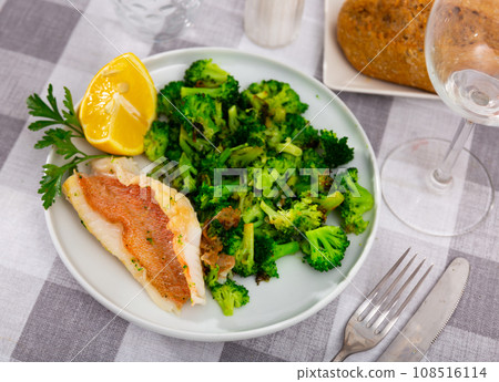 Appetizing fillet of gallineta with broccoli Appetizing fillet of gallineta with broccoli 108516114