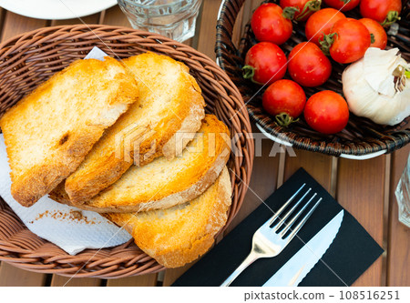 Ingredients for traditional Spanish Pa amb tomaquet 108516251