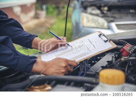 Close up Man hands fixing Car machinery vehicle mechanical service. Mechanic man hands repairing car auto repair shop. open vehicle hood checking up auto mobile. Vehicle Car maintenance engineer. Close up Man hands fixing Car machinery vehicle mechanical service. Mechanic man hands repairing car auto repair shop. open vehicle hood checking up auto mobile. Vehicle Car maintenance engineer. 108516265