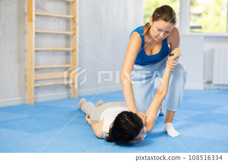 she skillfully applied pronating wristlock 108516334