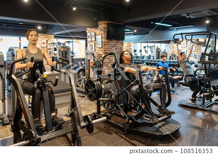 Fitness gym training young men and women 108516353