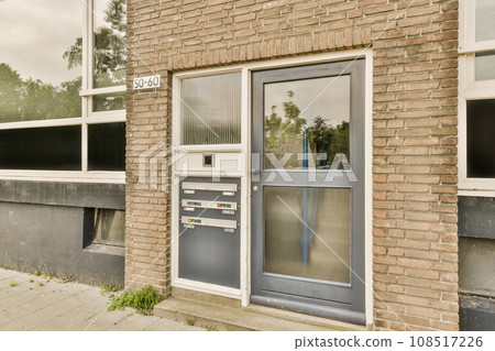 a brick building with an open door on the front and two windows in the back, one has a sign that says'no a brick building with an open door on the front and two windows in the back, one has a sign that says'no 108517226
