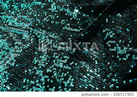 Christmas abstract background made of emerald green sequins. Christmas abstract background made of emerald green sequins. 108517305