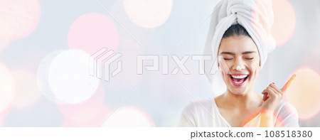 Woman, happy and beauty cream, skincare and funny morning routine on white background and bokeh overlay. Excited model with moisturizer, skin care and dermatology in studio and banner or mockup space 108518380