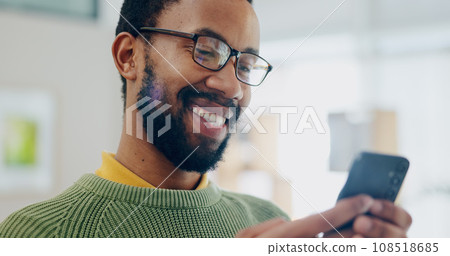 Happy, black man and phone text at house with smile from social media scroll and internet in a home. Mobile networking, male person and happy with app and blog search for online shopping and message 108518685