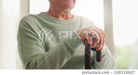 Hands, senior and walking stick, person with a disability and closeup with wellness. Elderly care, cane to help with balance and support with Parkinson disease or arthritis, sick and health issue Hands, senior and walking stick, person with a disability and closeup with wellness. Elderly care, cane to help with balance and support with Parkinson disease or arthritis, sick and health issue 108518687