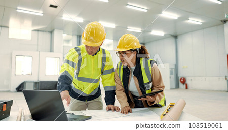 Architecture people, teamwork and laptop for construction site planning, floor plan and building design in warehouse. Industry worker and manager on tablet and computer for engineering and blueprint 108519061