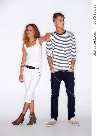 Fashion, couple of friends and clothes with style and people, trendy and stylish isolated on white background. Young, man and woman model in a studio with casual clothing, beauty and pose together Fashion, couple of friends and clothes with style and people, trendy and stylish isolated on white background. Young, man and woman model in a studio with casual clothing, beauty and pose together 108519118