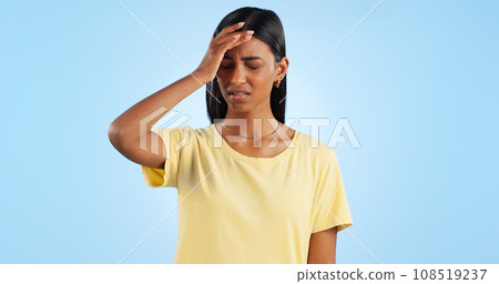 Headache, pain and stress, woman with fatigue in studio with health emergency and wellness on blue background. Migraine, brain fog and vertigo from medical condition with burnout, sick and tired Headache, pain and stress, woman with fatigue in studio with health emergency and wellness on blue background. Migraine, brain fog and vertigo from medical condition with burnout, sick and tired 108519237
