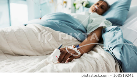 Healthcare, iv drip and senior woman in the hospital for consultation, surgery or treatment. Medical, recovery and elderly female patient resting in bed after operation or procedure in a clinic. 108519241