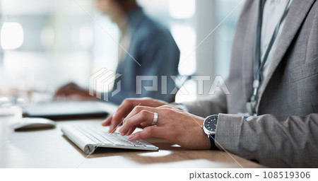 Keyboard, hands and businessman in the office typing for creative project research on a computer. Technology, career and professional male designer working on website or internet in modern workplace. Keyboard, hands and businessman in the office typing for creative project research on a computer. Technology, career and professional male designer working on website or internet in modern workplace. 108519306