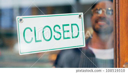 Happy man, small business or closed sign on window in coffee shop or restaurant for end of service. Closing time, smile or manager with board, poster or message in retail store or cafe for notice 108519310
