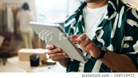 Man, tablet and hands in small business, logistics or supply chain for online research at fashion boutique. Closeup of male person working on technology for web search or networking at retail store Man, tablet and hands in small business, logistics or supply chain for online research at fashion boutique. Closeup of male person working on technology for web search or networking at retail store 108519472