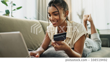 Credit Card, home laptop and happy woman online shopping, relax and check bank account balance, web store or budget. Digital money exchange, financial payment and customer buying on living room sofa 108519492