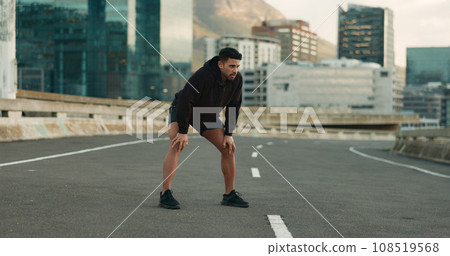 Man, athlete and breathe in road for fitness, exercise or wellness with city background or nature. Runner, person and relax or tired for workout, training and healthy body with sportswear in street Man, athlete and breathe in road for fitness, exercise or wellness with city background or nature. Runner, person and relax or tired for workout, training and healthy body with sportswear in street 108519568