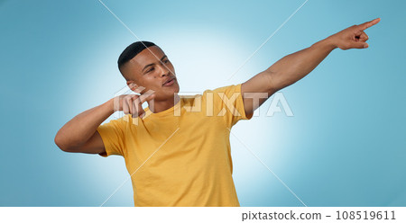 Pointing, announcement or man by offer, discount deal or sale on studio space or advertising. Breaking news, show or male person with mockup for guide, menu choice or promotion on blue background 108519611