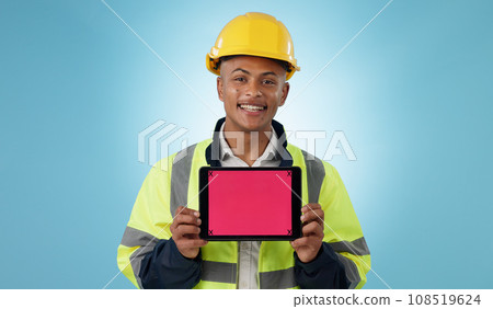 Engineering man, tablet screen and mockup for industrial presentation of renovation, architecture or design in studio. Portrait of construction worker with digital tracking markers on blue background 108519624
