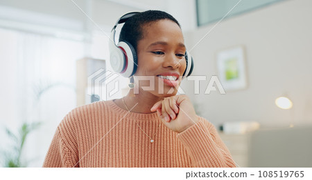 Woman, headphones and smile by laptop for remote work from home with thinking process, ideas or vision. Happy African girl, computer and listen for sound, freelancing and brainstorming for solution 108519765