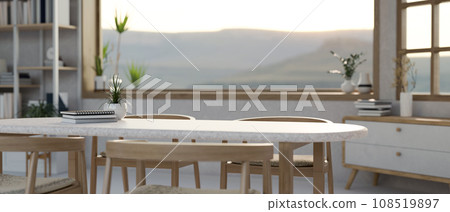 Empty space on a minimalist dining table in a beautiful Scandinavian dining room. Empty space on a minimalist dining table in a beautiful Scandinavian dining room. 108519897