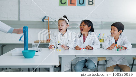 School kids, science club and happy for learning, wow and excited for information, experiment or knowledge. Children, boy and girl with education, volcano or scholarship for innovation in laboratory School kids, science club and happy for learning, wow and excited for information, experiment or knowledge. Children, boy and girl with education, volcano or scholarship for innovation in laboratory 108520059