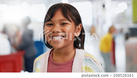 Portrait, girl and child with learning for knowledge, education and future with smile and confidence. Face, student and kid with happiness in classroom, school or academy for development and study 108520161