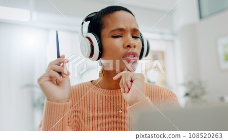 Remote work, black woman and speaking on a laptop for business, online planning or communication. House, strategy and an African freelance worker with conversation, headphones and talking on a pc Remote work, black woman and speaking on a laptop for business, online planning or communication. House, strategy and an African freelance worker with conversation, headphones and talking on a pc 108520263