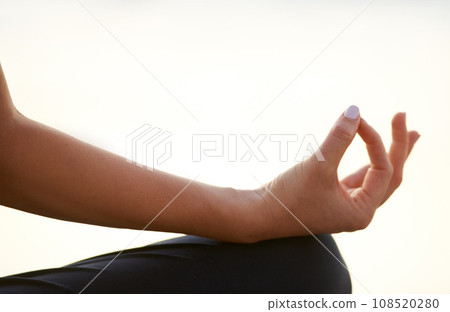Closeup, woman and hand for yoga with meditation for wellness of health, mindset or zen with peace. Female person, fingers or half lotus pose for chakra, breathing or relaxing for practice by outdoor Closeup, woman and hand for yoga with meditation for wellness of health, mindset or zen with peace. Female person, fingers or half lotus pose for chakra, breathing or relaxing for practice by outdoor 108520280