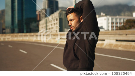 Man, stretching and fitness in city for exercise, workout or outdoor training on road or street. Active male person, runner or athlete in body warm up or arm stretch getting ready in an urban town Man, stretching and fitness in city for exercise, workout or outdoor training on road or street. Active male person, runner or athlete in body warm up or arm stretch getting ready in an urban town 108520494