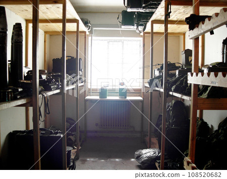 Military base, room and equipment for war, training or defense team on a mission for battle. Storage, army and guns or gear at warrior security bootcamp for government armed forces service warzone. Military base, room and equipment for war, training or defense team on a mission for battle. Storage, army and guns or gear at warrior security bootcamp for government armed forces service warzone. 108520682