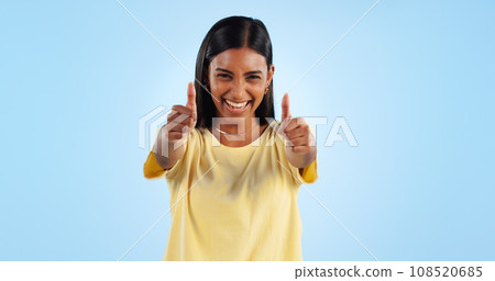 Woman, happy in portrait and thumbs up for agreement, success or support with hand gesture on blue background. Like, yes and emoji with feedback, vote or opinion in studio with thank you or praise Woman, happy in portrait and thumbs up for agreement, success or support with hand gesture on blue background. Like, yes and emoji with feedback, vote or opinion in studio with thank you or praise 108520685