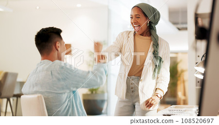 Fist bump, excited and business people in an office for success, celebration or teamwork. Happy, collaboration and a Muslim employee with a man for a thank you, partnership or friends handshake Fist bump, excited and business people in an office for success, celebration or teamwork. Happy, collaboration and a Muslim employee with a man for a thank you, partnership or friends handshake 108520697