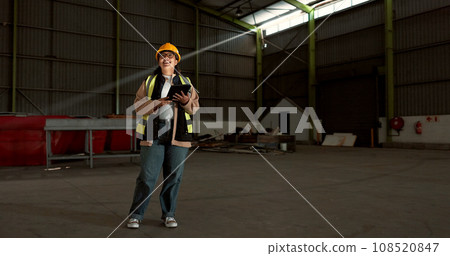 Engineer woman, tablet and smile in warehouse for logistics, supply chain or thinking process with app. Employee, helmet and happy with ideas at shipping workshop, factory and vision with touchscreen Engineer woman, tablet and smile in warehouse for logistics, supply chain or thinking process with app. Employee, helmet and happy with ideas at shipping workshop, factory and vision with touchscreen 108520847