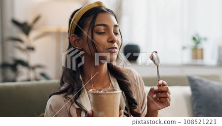 Woman, eating ice cream and living room on couch, thinking or idea for dessert, sweets or relax in home. Girl, gelato or frozen yogurt for snack, lounge sofa and house with memory, choice or decision Woman, eating ice cream and living room on couch, thinking or idea for dessert, sweets or relax in home. Girl, gelato or frozen yogurt for snack, lounge sofa and house with memory, choice or decision 108521221