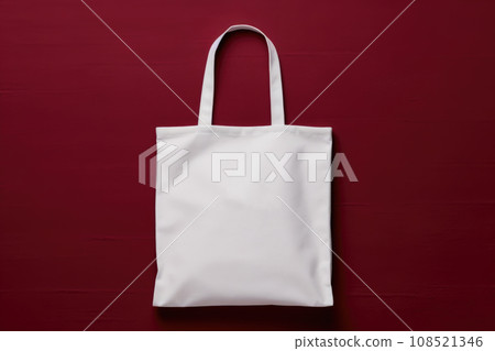 White fabric bag on a burgundy background White fabric bag on a burgundy background 108521346