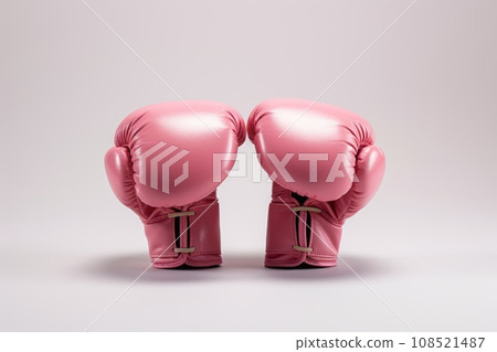 A pair of boxing gloves in pink color A pair of boxing gloves in pink color 108521487