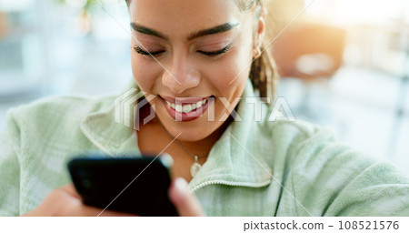 Happy, woman and typing with phone on sofa in home, living room or apartment with internet communication or contact us. Funny, meme or video on social media and person chat online with cellphone Happy, woman and typing with phone on sofa in home, living room or apartment with internet communication or contact us. Funny, meme or video on social media and person chat online with cellphone 108521576