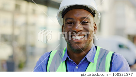 Happy man, engineering portrait and construction site, project management or outdoor, city building. Face of african person, builder or architecture worker in urban development or property renovation 108521577