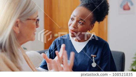 Frustrated, sad woman speaking or nurse with results in consultation for bad news or cancer. Stress, lady talking or caregiver with a depressed mature patient for empathy, sympathy or help in home Frustrated, sad woman speaking or nurse with results in consultation for bad news or cancer. Stress, lady talking or caregiver with a depressed mature patient for empathy, sympathy or help in home 108521835
