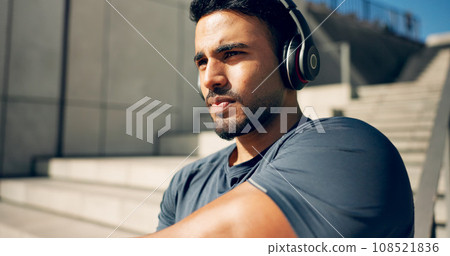 Fitness, music headphones and man on stairs in city, workout and exercise for body health. Radio, serious athlete and person on steps in urban town, listening to audio or podcast, sound and thinking Fitness, music headphones and man on stairs in city, workout and exercise for body health. Radio, serious athlete and person on steps in urban town, listening to audio or podcast, sound and thinking 108521836