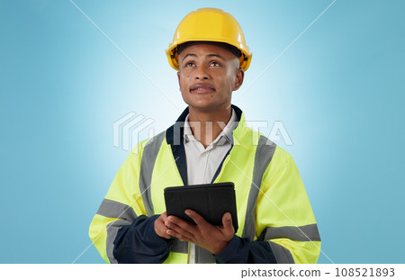 Engineering, man and tablet for inspection, thinking of renovation or project management on blue background. Construction worker with architecture survey, looking up and digital technology in studio 108521893