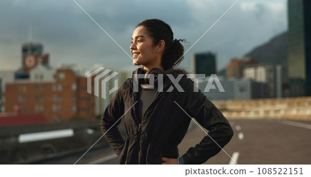 Training, city smile and outdoor woman looking at view, buildings and happy for morning cardio, wellness or workout. Happiness, fitness and urban athlete, runner or person exercise in Chicago, USA 108522151