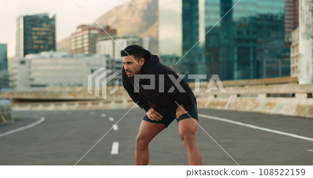 Man, athlete and breathe in road for fitness, exercise or wellness with city background or nature. Runner, person and break or tired for workout, training and healthy body with sportswear in street Man, athlete and breathe in road for fitness, exercise or wellness with city background or nature. Runner, person and break or tired for workout, training and healthy body with sportswear in street 108522159