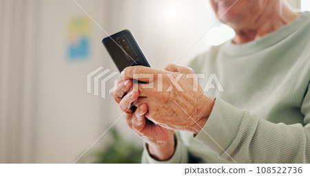 Home, closeup and senior hands with a smartphone, typing and connection with social media, digital app and contact. Old man, pensioner or mature guy with a cellphone, mobile user and search internet 108522736