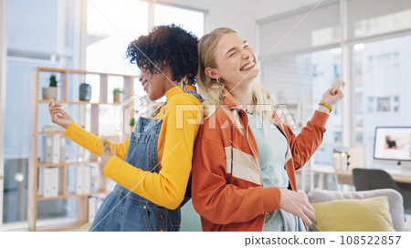 Women, lesbian couple and dance in home, happy and air guitar in living room. Gay girls, party and moving to music in celebration, bonding or smile for freedom, energy or excited in interracial house 108522857