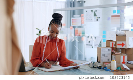 Fashion, designer and black woman with checklist for delivery, logistics and ecommerce in workshop. Retail, boutique and person with boxes for creative startup, small business and supply chain Fashion, designer and black woman with checklist for delivery, logistics and ecommerce in workshop. Retail, boutique and person with boxes for creative startup, small business and supply chain 108523145