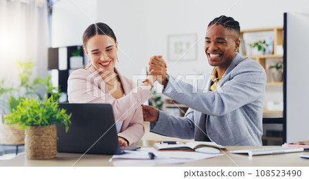 Laptop, surprise and business people celebrate, high five and excited for financial growth, project feedback or success. Achievement, winner and diversity team happy for deal, profit or sales revenue Laptop, surprise and business people celebrate, high five and excited for financial growth, project feedback or success. Achievement, winner and diversity team happy for deal, profit or sales revenue 108523490